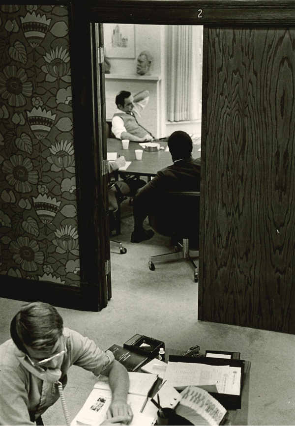 John McKnight leads a meeting in the IPR Conference Room.