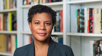 image of Alondra Nelson in front of bookshelf