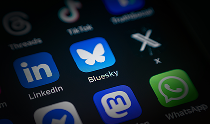 Bluesky App icon among various application icons on smartphone screen