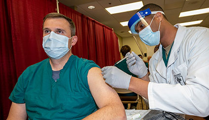 Doctor getting vaccinated