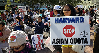 Asian American woman protesting