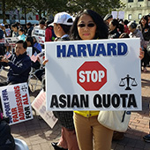 Asian American woman protesting