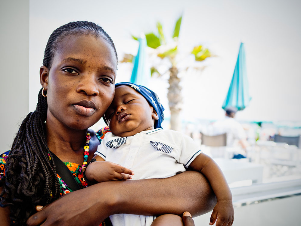 Migrant woman and her baby