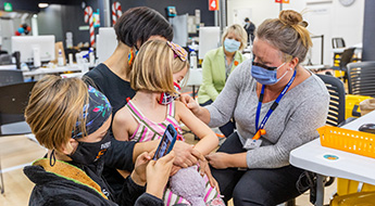 Child receives her COVID-19 vaccination