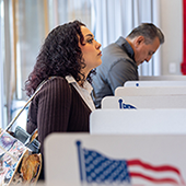 image of a woman at the ballot box
