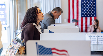 image of a woman at the ballot box