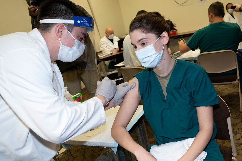 Doctor receives a COVID-19 vaccine