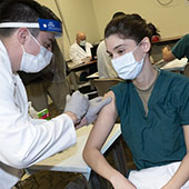 Doctor receives a COVID-19 vaccine