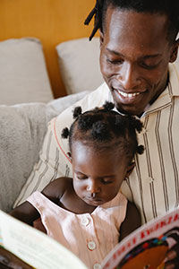 Father and daughter reading