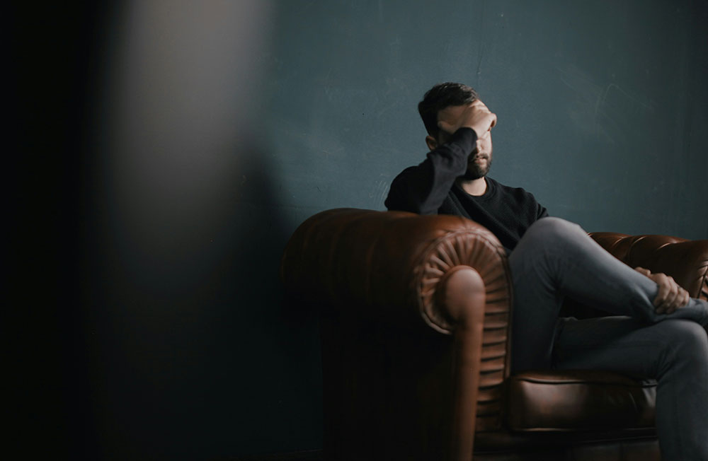 Young man sitting on chair