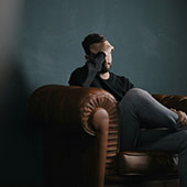 Young man sitting on chair