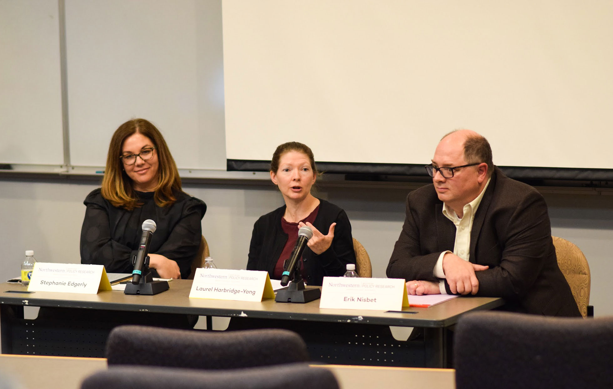 Laurel Harbridge-Yong, Stephanie Edgerly, and Erik Nisbet on a panel
