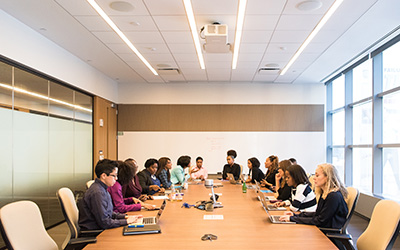 Conference room with people working