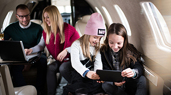 wealth family on a private plane