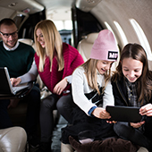 wealth family on a private plane