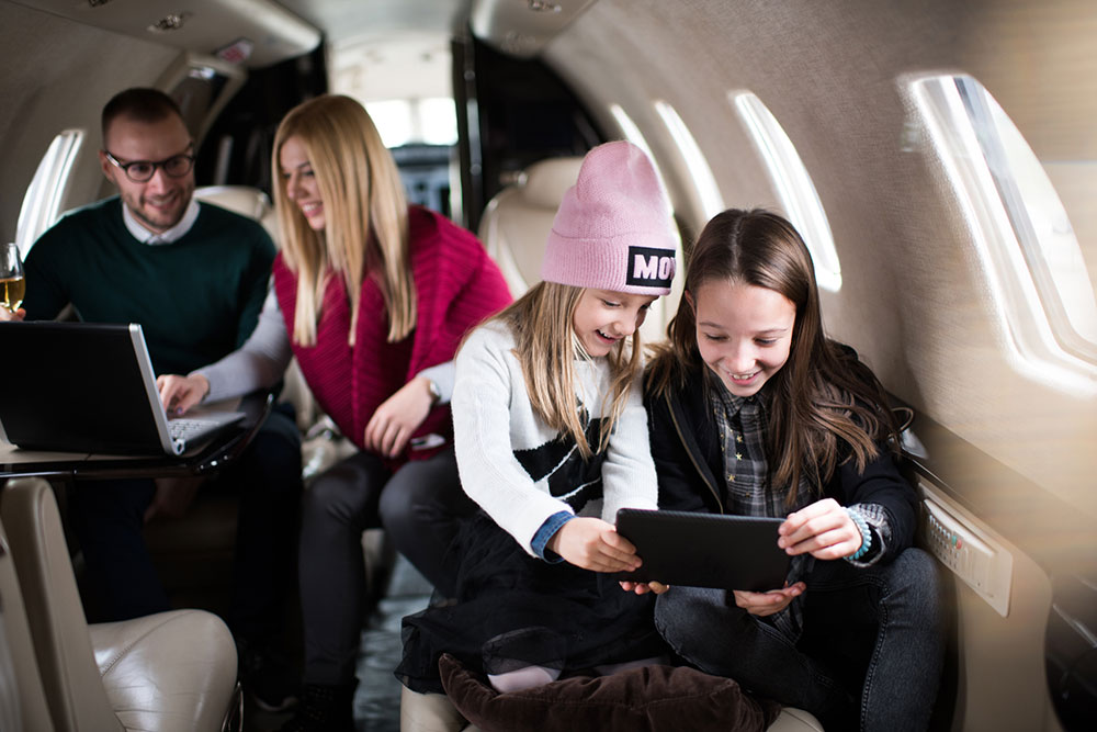 wealth family on a private plane