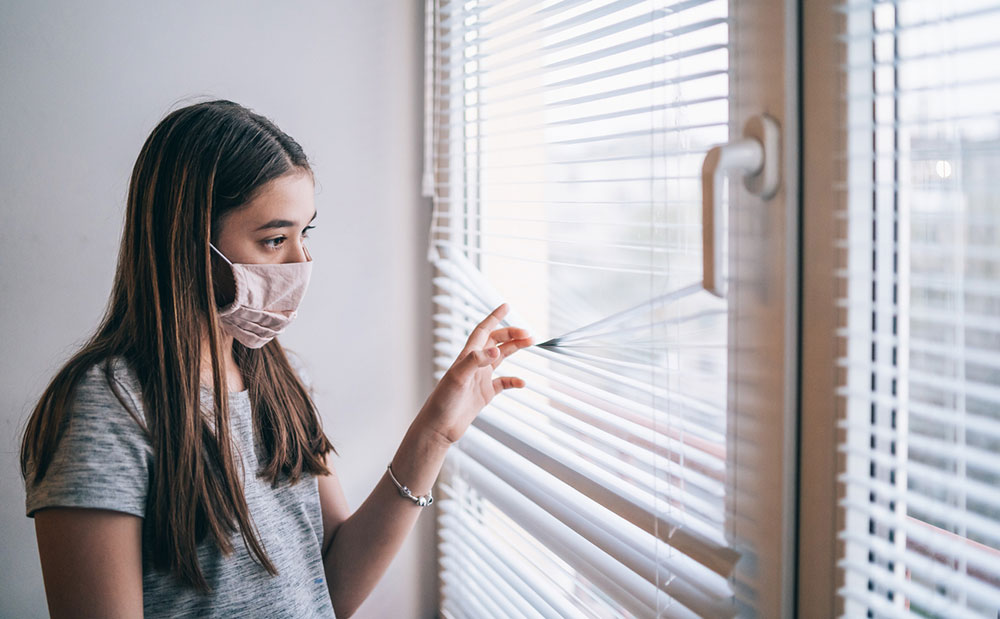 Teenager looking out the window