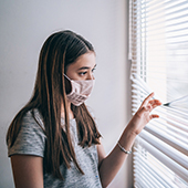 Teenager looking out the window