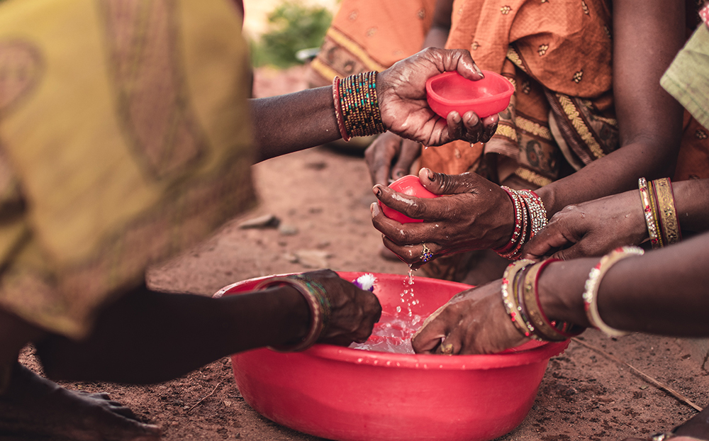 Women cleaning with water