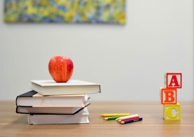 school books and apple