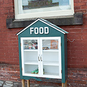 food pantry box in front of a brick wall