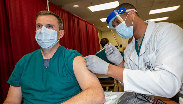 Doctor receives his vaccination