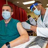 Doctor receives his vaccination