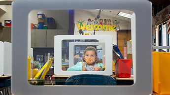 Girl wearing mask inside classroom
