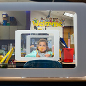 Girl wearing mask inside classroom