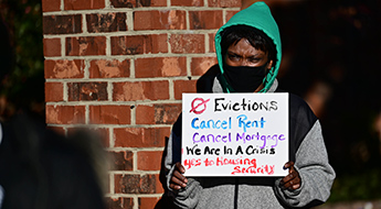 Woman at rent relief protest