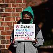 Woman at rent relief protest