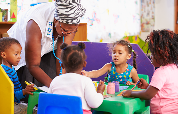 teacher in classroom with pre-k students