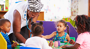 teacher in classroom with pre-k students