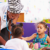 teacher in classroom with pre-k students