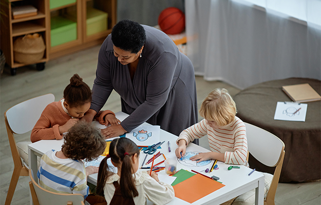 preschoolers in class with a teacher