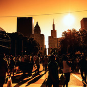 a crowded street in downtown Chicago on a hot summer day