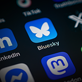 Bluesky App icon among various application icons on smartphone screen