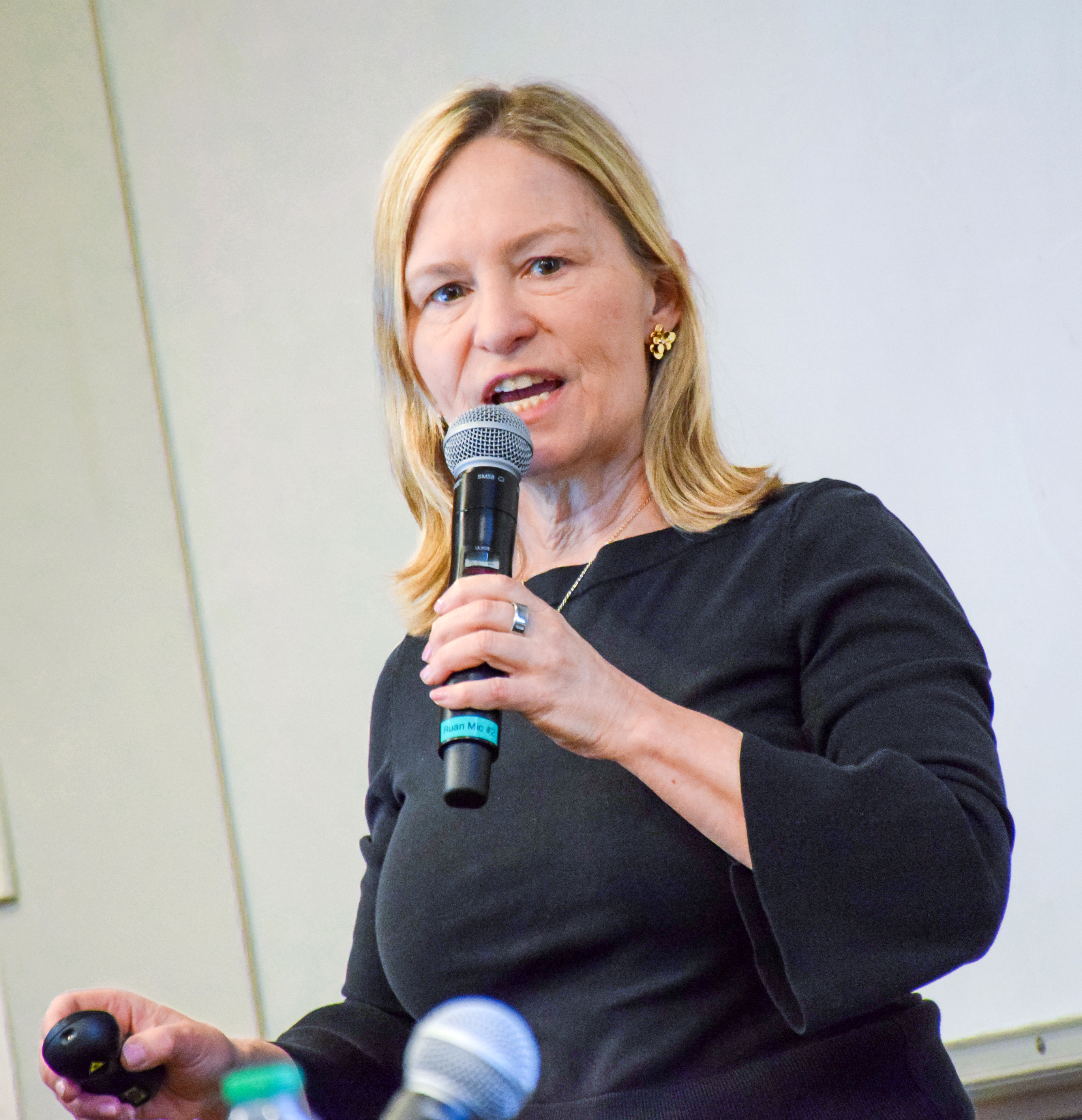 Panelist Emma Adam speaking into a microphone