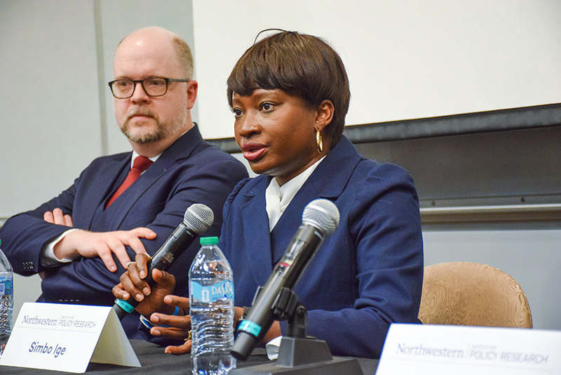 Panelist speaking into a microphone