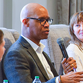 Panelist speaking into a microphone