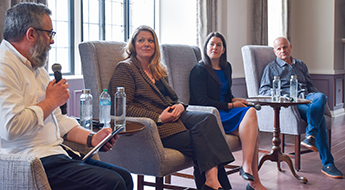 Beth Tipton, Katie Insel, and Dean Karlan speak at an IPR panel.