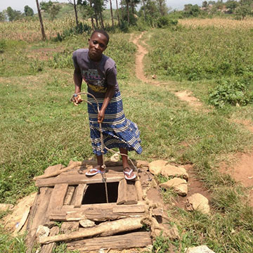 man gather water from a well
